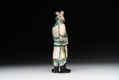 A fine Chinese verte biscuit figure of a warrior on wooden stand, Kangxi