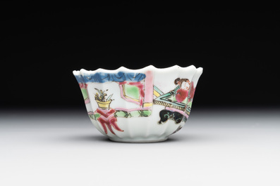A Chinese famille rose cup and saucer with a reclined lady, Qianlong