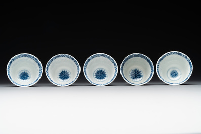 Five fine Chinese blue and white cups and saucers, 19th C.