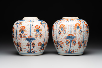 A pair of Chinese Imari-style 'grapevine' jars with wooden covers and stands, Kangxi