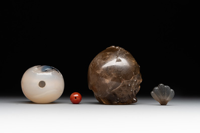 Two Chinese agate snuff bottles in the form of a bird and a pekinese, 19th C.