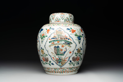 A Chinese famille verte 'figures and antiquities' jar and cover, Kangxi