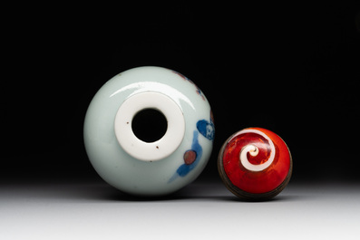A Chinese blue, white and copper-red snuff bottle, 19th C.