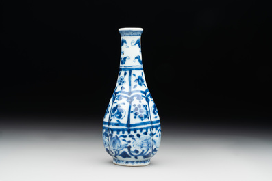 A Chinese blue and white facetted bottle vase with floral design, Kangxi