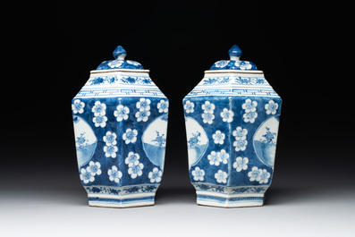 A pair of Chinese blue and white hexagonal jars and covers with a lady holding a fan, 19th C.