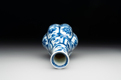 A Chinese blue and white facetted bottle vase with floral design, Kangxi