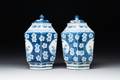 A pair of Chinese blue and white hexagonal jars and covers with a lady holding a fan, 19th C.