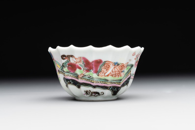 A Chinese famille rose cup and saucer with a reclined lady, Qianlong