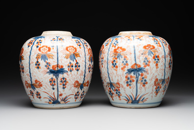 A pair of Chinese Imari-style 'grapevine' jars with wooden covers and stands, Kangxi