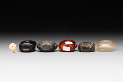 Eleven Chinese snuff bottles in amber, agate, rock crystal, lacquer, hardstone, metal and wood, 19/20th C.