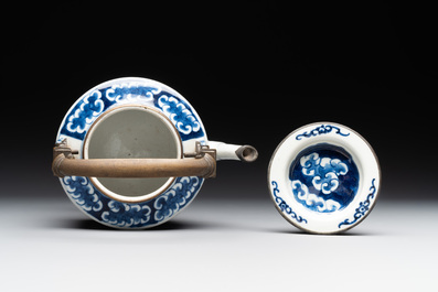 A Chinese polished purple Yixing stoneware covered teapot for the Thai market and a blue and white covered teapot, 19th C.