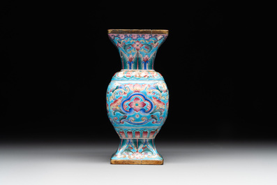 A Chinese Canton enamel 'gu' vase with floral design, Qianlong mark and of the period