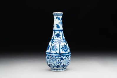 A Chinese blue and white facetted bottle vase with floral design, Kangxi