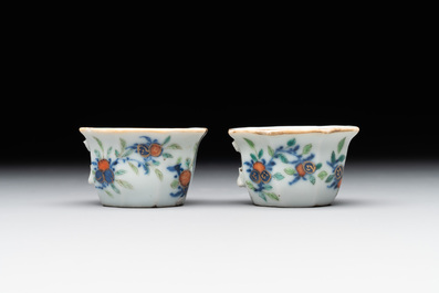 A Chinese blue, white and famille rose tea service, three famille rose bowls, a plate and a covered jar, 19th C.