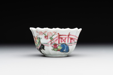 A Chinese famille rose cup and saucer with a reclined lady, Qianlong