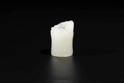 A Chinese white jade carving of a chilong reclining on bamboo, Qing
