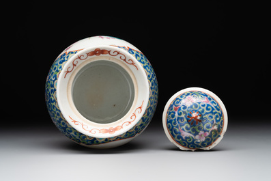 A Chinese blue, white and famille rose tea service, three famille rose bowls, a plate and a covered jar, 19th C.