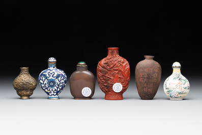 Eleven Chinese snuff bottles in amber, agate, rock crystal, lacquer, hardstone, metal and wood, 19/20th C.