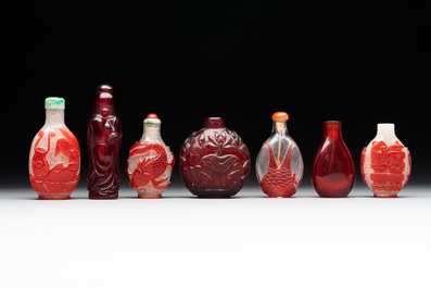 A group of seven Chinese red-overlay glass and red glass snuff bottles, 19/20th C.