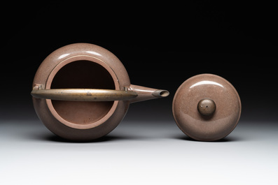 A Chinese polished purple Yixing stoneware covered teapot for the Thai market and a blue and white covered teapot, 19th C.