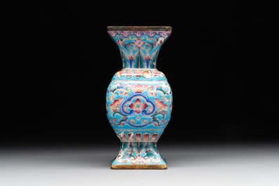 A Chinese Canton enamel 'gu' vase with floral design, Qianlong mark and of the period