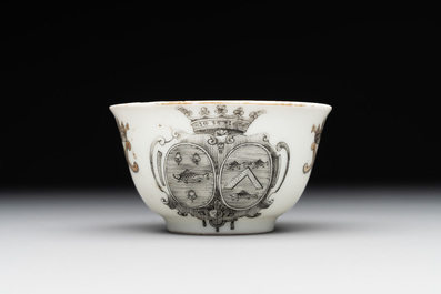 A Chinese gilt-decorated grisaille armorial cup and saucer, Qianlong
