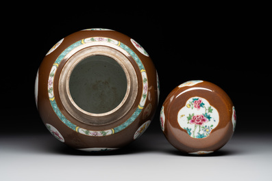 A pair of Chinese capucin-brown-ground famille rose covered jars with floral design, Yongzheng/Qianlong