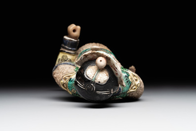 A fine Chinese verte biscuit figure of a warrior on wooden stand, Kangxi