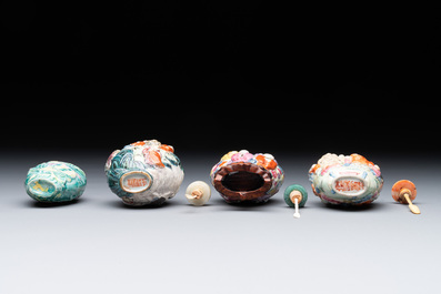 Eight Chinese moulded famille rose snuff bottles, Qianlong mark, 19th C.