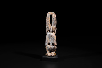 A Chinese jade carving of a crouched figure, possibly Hongshan culture