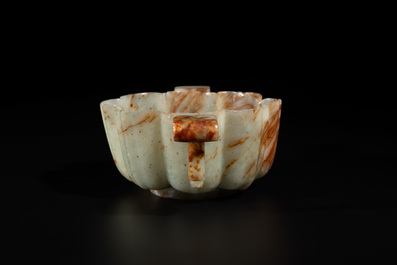 A Chinese celadon and russet jade wedding cup, 18th C.