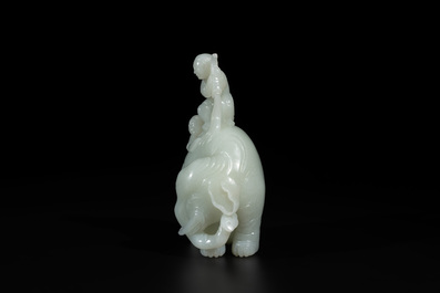 A Chinese celadon jade group of two boys cleansing an elephant, 18th C.