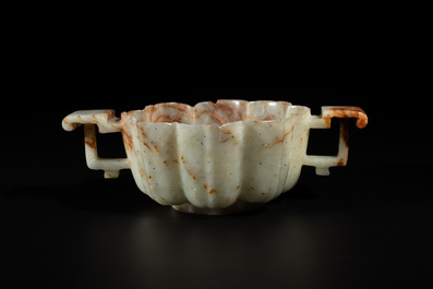 A Chinese celadon and russet jade wedding cup, 18th C.