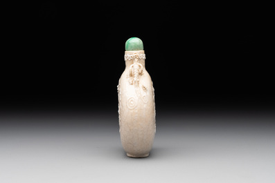 A rare Chinese monochrome ge-type 'chilong' snuff bottle with jadeite stopper, Qianlong mark and of the period