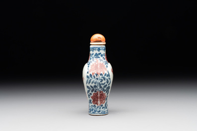 A Chinese blue, white and copper-red snuff 'deer' bottle, Yongzheng mark and of the period