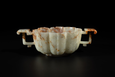 A Chinese celadon and russet jade wedding cup, 18th C.