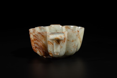 A Chinese celadon and russet jade wedding cup, 18th C.