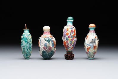 Eight Chinese moulded famille rose snuff bottles, Qianlong mark, 19th C.