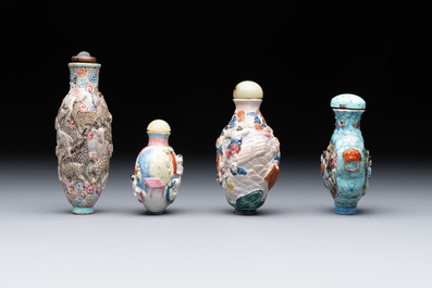 Eight Chinese moulded famille rose snuff bottles, Qianlong mark, 19th C.
