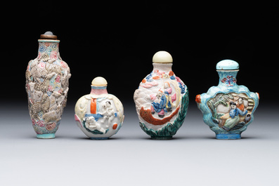 Eight Chinese moulded famille rose snuff bottles, Qianlong mark, 19th C.