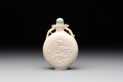 A rare Chinese monochrome ge-type 'chilong' snuff bottle with jadeite stopper, Qianlong mark and of the period