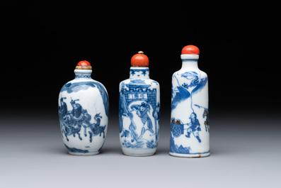 Two Chinese blue and white snuff bottles and a blue, white and copper-red snuff bottle, Yongzheng mark, 19th C.