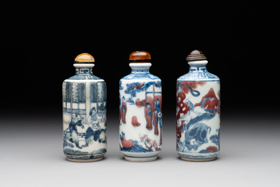 Three Chinese blue, white and copper-red snuff bottles, 19th C.