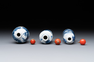 Two Chinese blue and white snuff bottles and a blue, white and copper-red snuff bottle, Yongzheng mark, 19th C.