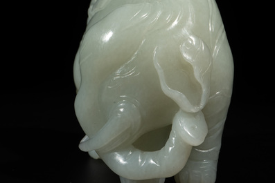 A Chinese celadon jade group of two boys cleansing an elephant, 18th C.