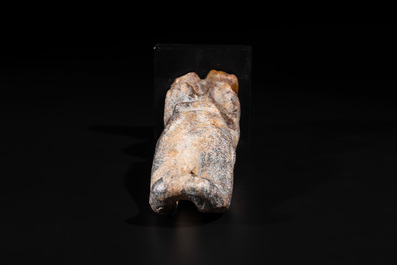 A Chinese jade carving of a crouched figure, possibly Hongshan culture