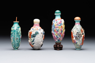 Eight Chinese moulded famille rose snuff bottles, Qianlong mark, 19th C.