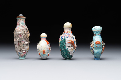 Eight Chinese moulded famille rose snuff bottles, Qianlong mark, 19th C.