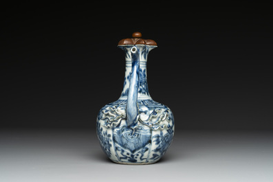 A fine Chinese blue and white 'pomegranate' kendi and a wooden cover, Wanli