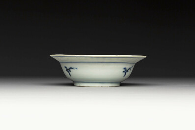 A group of thirteen Chinese blue, white and famille rose plates and a bowl, late Ming/early Qing
